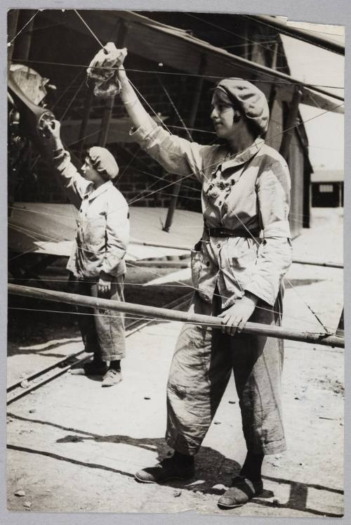 [Women working on an aeroplane]