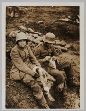 D.2041. Battle of Menin Road - two youthful Hun prisoners waiting their turn for their wounds to be dressed outside a dressing station