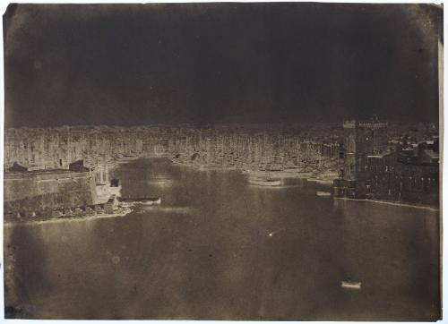 View over the Port of Marseille. A figure in a small boat in lower right of image.