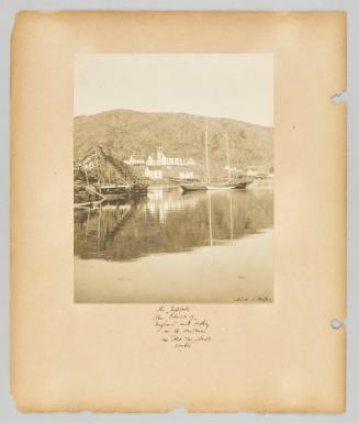 In Exploits. The Church of England and rectory in the distance. The Rev. M. Bull, rector ; Page 45 of Newfoundland from Collection of Canadian albums compiled by Edith S. Watson
