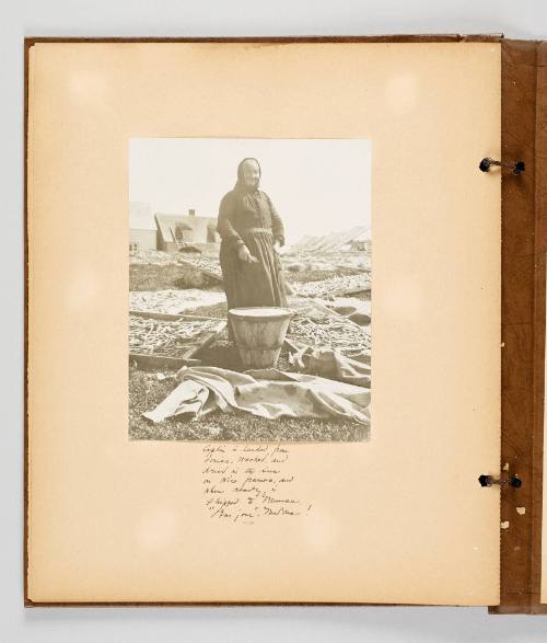 Caplin is landed from dories, mashed, and dried in the sun on wire frames, and when ready is shipped to France. "Bonjour", Madame! Page 49 of Fish; from collection of Canadian albums compiled by Edith S. Watson, 1890s-1930s