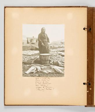Caplin is landed from dories, mashed, and dried in the sun on wire frames, and when ready is shipped to France. "Bonjour", Madame! Page 49 of Fish; from collection of Canadian albums compiled by Edith S. Watson, 1890s-1930s