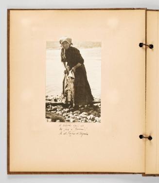 A reliable hand at the fish is "Jeanne"! In St. Pierre et Miquelon. Page 44 of Fish; from collection of Canadian albums compiled by Edith S. Watson, 1890s-1930s