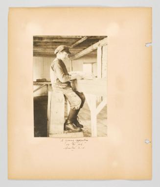 "A young apprentice at the fish." Sambro, N.S. Page 24 of Fish; from collection of Canadian albums compiled by Edith S. Watson, 1890s-1930s