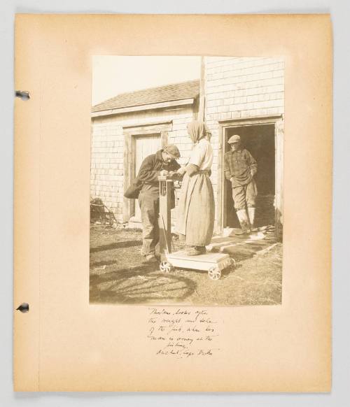 Madame looks after the weight and sale of the fish, when her man is away at the fishing, Arichat, Cape Breton. Page 23 of Fish; from collection of Canadian albums compiled by Edith S. Watson, 1890s-1930s