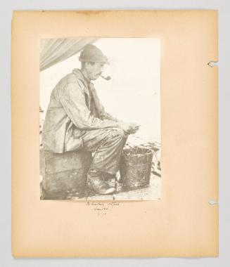 Beheading codfish, Sambro, N.S. Page 18 of Fish; from collection of Canadian albums compiled by Edith S. Watson, 1890s-1930s