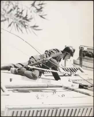 A policeman scales a building in the aftermath of the Fruili earthquake in 1976