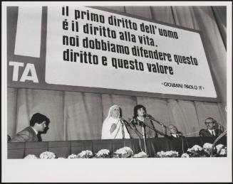 Mother Teresa speaks at an anti abortion event underneath the quote- "The first right of man is the right of life, we have to defend this right and this value"- Pope John Paul II