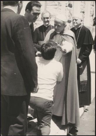  A worshipper goes through the Police barrier to ask Pope Paul VI for a blessing