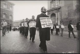 Priests marching in St. Peter's Square, protesting against the unjust  treatment of Buddhist monks