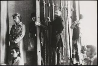 Members of the public climb railings and gates in order to see an event at the Apostolic Palace in Rome