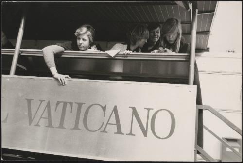 Girls aboard a bus platform to Vatican city