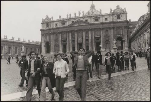 Young people by the church of St. Peter's behind them, Vatican City, Rome