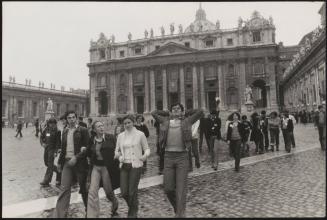 Young people by the church of St. Peter's behind them, Vatican City, Rome