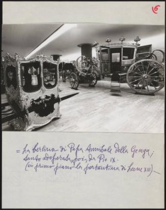 A room containing the sedan chair of Pope Leone XIII, also used by Pope Pio IX, and other papal carriages