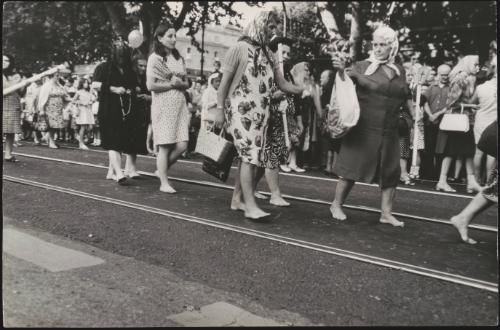 Barefoot women walk in a religious procession in Trastevere, Rome