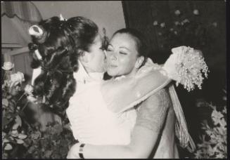 Actress Annabella Incontrera and film critic Lorella De Luca embrace on Incontrera's wedding day, 1969