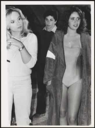 Snapshot of Alessandra Mussolini in a bathing suit and robe with the television announcer Maria Giovanna Elmi