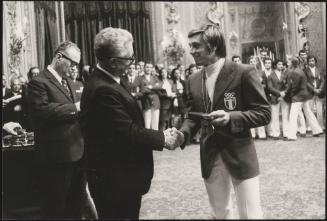 Giovanni Leone presents the Olympic diver, Franco Giorgio Cagnotto with a medal 