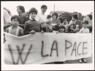 Children holding a banner at a peace march