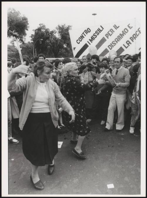 Two women dance at an anti-nuclear-missile protest march