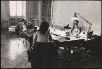 Gianfranco Spadaccia of the Radical Party sits at the desk of Gianni Cervigni, from Il Giorno newspaper
