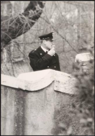 A policeman eats an ice cream
