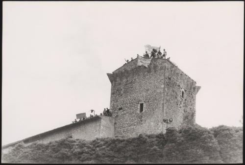 A group of protesters on the roof of a prison  