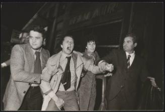 A protester is escorted away 