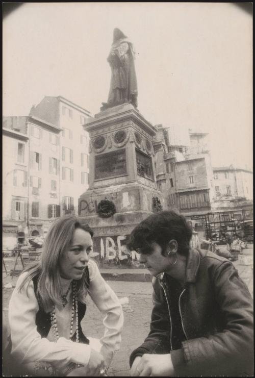 Joanna Harcourt-Smith next to the defaced monument to Giordano Bruno in Piazza Campo de Fiori, Rome