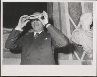 The politician Franco Malfatti looking through a Pan-Pet stereoscopic viewer