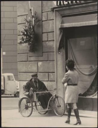 Old man in an invalid carriage 