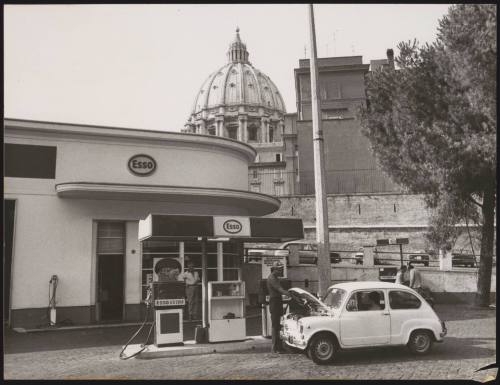 A man fills his tank up at an Esso petrol station 