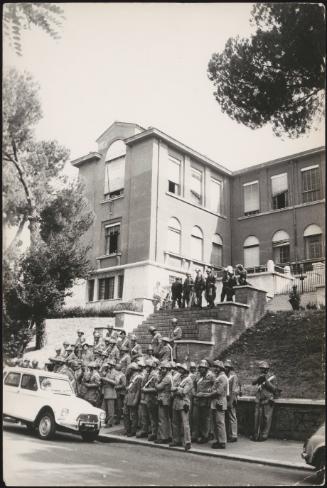 Group of wardens waiting at the base of the steps to the Architecture schools, Rome