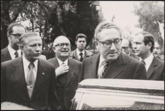 John Volpe, Mariano Rumor and Henry Kissinger getting into a car 