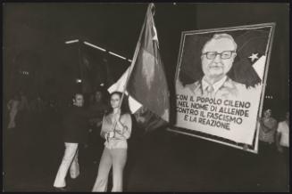 Protesters carry a portrait of Salvador Allende