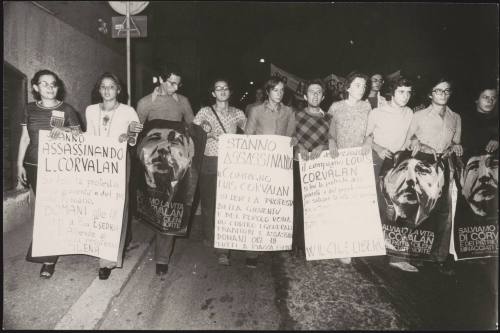 Protesters carrying placards with messages of solidarity with Chile and Luis Corvalan, the general secretary of the Communist Party of Chile