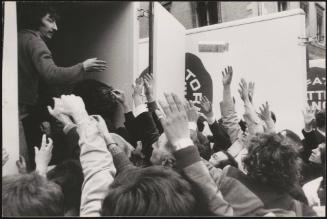 Farmer's handing out milk from the back of milk trucks during an agriculture demonstration
