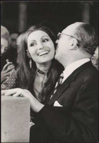 Guido Piovene whispers to Rosanna Schiaffino