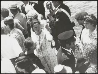 Filicudi residents at their island's port, protesting at the arrival of 15 members of the Mafia on to the island