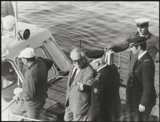 A Mafia member aboard a police boat, disembarking at Filicudi, May 1971