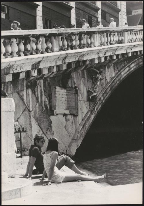 An Italian 'Pappagalli' man and a female tourist, Venice