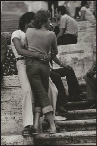 An Italian 'Pappagalli' man with his female tourist on the Spanish Steps, Rome