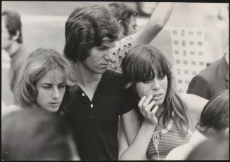 An Italian 'Pappagalli' man with two female tourists 