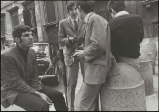 Italian 'Pappagalli' men waiting in a tourist spot to pick up female tourists 