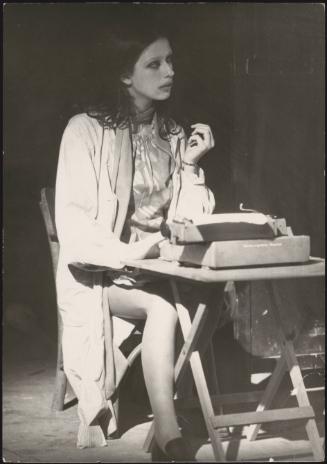 A young woman performing in a theatre piece 