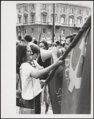 Woman holding flag at PCI demonstration