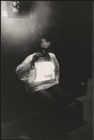 Portrait of Hungarian director Miklós Jancsó on a cigarette break on set