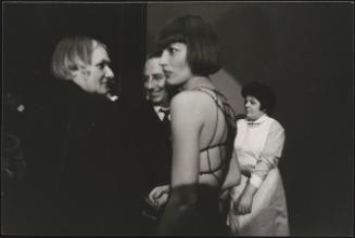 Portrait of Hungarian director Miklós Jancsó talking to actors on set