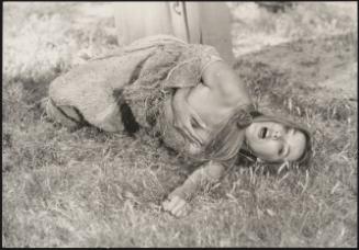 Actress Barbara Bouchet in a hessian sack on an unspecified film set